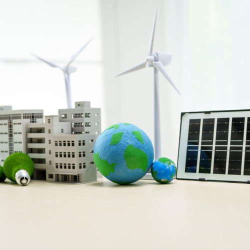 a-white-desk-displays-a-model-of-an-electric-car-2025-03-09-19-30-38-utc-min